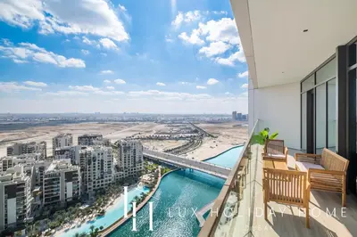 a view from the balcony of a building with a pool at LUX The Creek Palace Residence Suite in Dubai