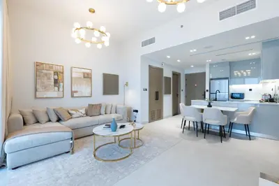 a living room with a couch and a table at Keyrock Living - Binghatti Canal Luxury Stay in Dubai