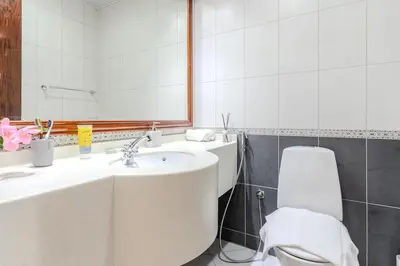 a bathroom with a sink and a toilet and a mirror at Luxury 3 bedroom with Stunning Full Marina View in Dubai in Dubai