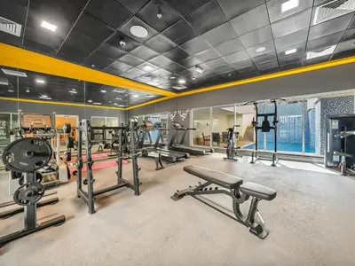 a gym with several treadmills and cardio machines at Luxury 3 bedroom with Stunning Full Marina View in Dubai in Dubai