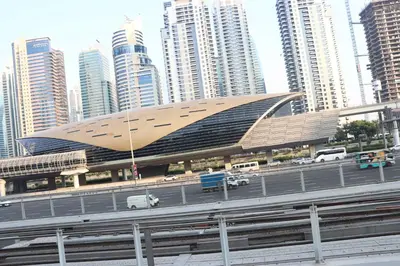 a large building in a city with tall buildings at Panoramic Marina View in Dubai