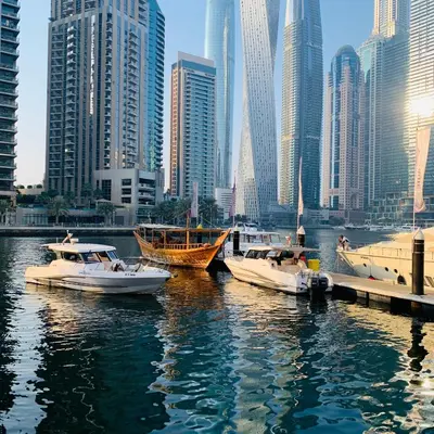 a group of boats docked in the water in a city at Panoramic Marina View in Dubai