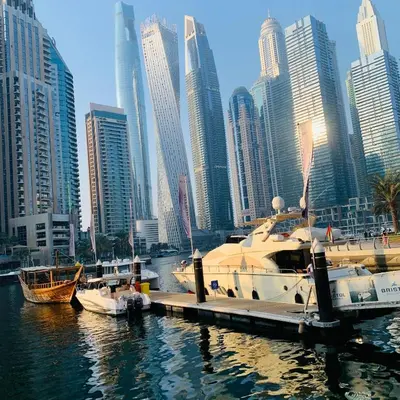 a group of boats docked at a dock in a city at Panoramic Marina View in Dubai