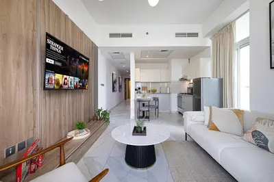 a living room with a couch and a table at Panoramic! Burj Khalifa and Canal View! in Dubai
