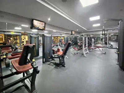 a gym with a lot of cardio equipment in it at HAVN - Studio Apartment in Goldcrest Views, JLT in Dubai
