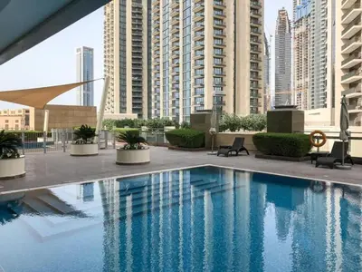 a swimming pool in a city with tall buildings at HAVN - Studio in 8 Boulevard, Downtown Dubai in Dubai