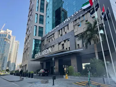 a building with a sign on the front of it at ASHRI HH, Bohemian Style Condo in Downtown in Dubai
