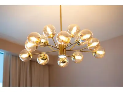 a chandelier hanging from a ceiling in a room at KeyRock Living - Stylish 1BR with Pool Access in Dubai
