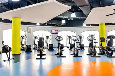 a gym with treadmills and elliptical machines at HAVN - Studio in Murjan JBR, 5mins to JBR Beach in Dubai