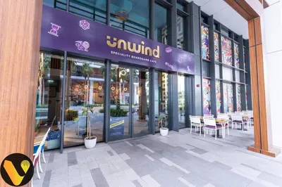 a store with a purple sign on the front of a building at Vogue Al Wasl 1 Residences Near Zabeel Park and World Trade Centre, One Bedroom Apartment with Balcony and City View, Access to all Amenities, Walkable to Max Fashion Metro Station in Dubai