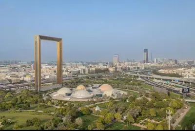 an aerial view of a building with a city in the background at Vogue Al Wasl 1 Residences Near Zabeel Park and World Trade Centre, Two Bedroom Apartment with Balcony offering Dubai Frame and City View, Access to all Amenities, Walkable to Max Fashion Metro Station in Dubai