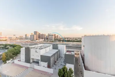 an aerial view of a large building with a city at City Views 1BR Close to Golf Course & Attractions, Binghatti Venus, Jumeirah Village Circle by Deluxe Holiday Homes in Dubai