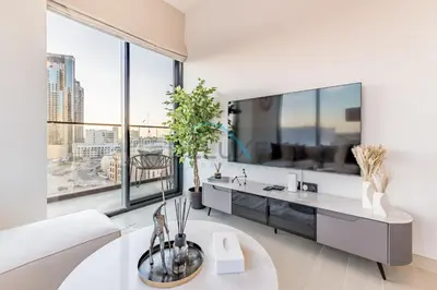 a white living room with a large window at City Views 1BR Close to Golf Course & Attractions, Binghatti Venus, Jumeirah Village Circle by Deluxe Holiday Homes in Dubai