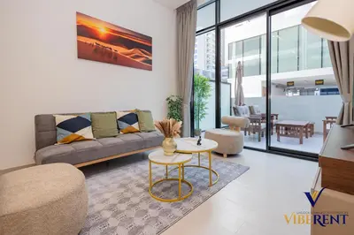 a living room with a couch and a table at 1-BR Binghatti Rooftop Pool, Gym in Dubai