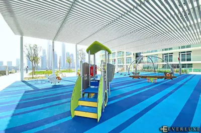 a playground in a building with a slide at Chill 1br W Beach Views & Private Beach Access in Dubai