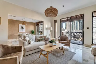 a living room with a couch and a table at GuestReady - Downtown retreat with city views in Dubai