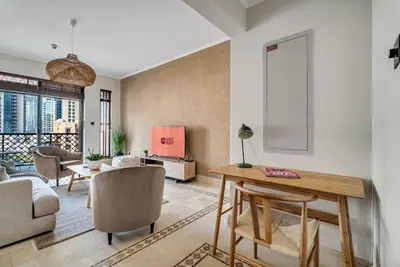 a living room with a table and a couch at GuestReady - Downtown retreat with city views in Dubai