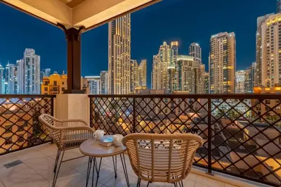 a balcony with chairs and a view of the city at GuestReady - Downtown retreat with city views in Dubai