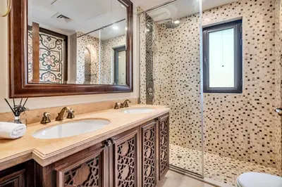 a bathroom with a sink and a shower at GuestReady - Downtown retreat with city views in Dubai