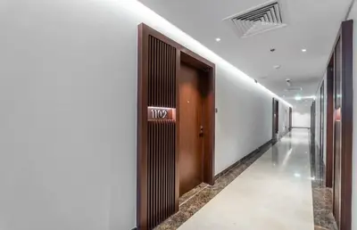 a hallway with a door in a building at Luxury Apt with Full Burj Khalifa Skyline Views in Dubai