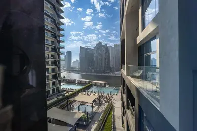 a view of a swimming pool from a building at Water Front Apartment, Burj Khalifa Views in Dubai