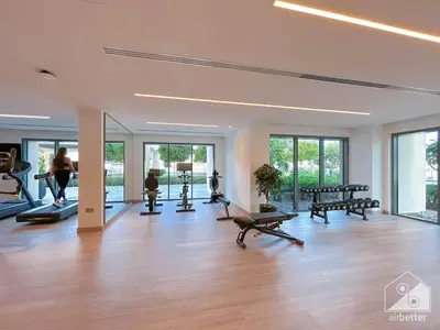 a gym with treadmills and exercise equipment in a room at Luxurious Burj Royale 1B Apt With Balcony & City Views in Dubai