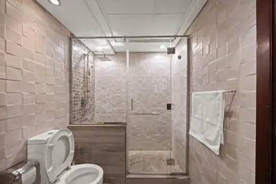 a bathroom with a toilet and a shower at Burj Khalifa View Apartment with Balcony Downtown Dubai in Dubai