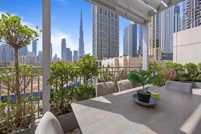 a table on a balcony with a view of the city at Burj Khalifa View Apartment with Balcony Downtown Dubai in Dubai