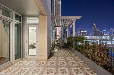 a balcony with a view of the city at night at Burj Khalifa View Apartment with Balcony Downtown Dubai in Dubai