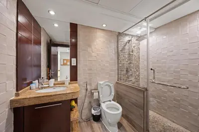 a bathroom with a toilet and a sink and a shower at Burj Khalifa View Apartment with Balcony Downtown Dubai in Dubai