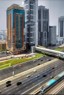 a highway in a large city with cars on it at Cozy Dubai Marina Suite in Dubai