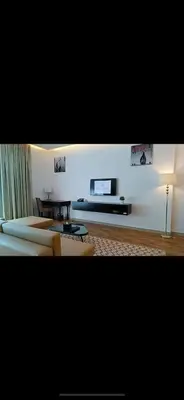 a living room with a couch and a table at Cozy Dubai Marina Suite in Dubai