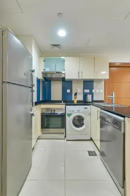 a kitchen with a washer and a dishwasher at Cozy 2bd in Dubai Marina in Dubai