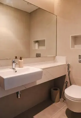 a bathroom with a sink and a toilet at Luxury Jumeirah canal front designer stay sleeps4 in Dubai