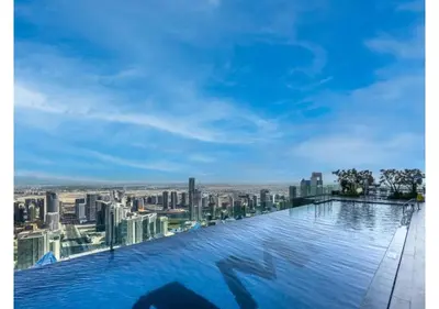 a swimming pool on top of a building with a city at KeyRock Living - Luxe Retreat at Paramount in Dubai