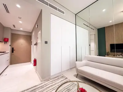 a living room with a couch and a table at Stylish Studio in the Heart of Al Furjan 20AB4 in Dubai
