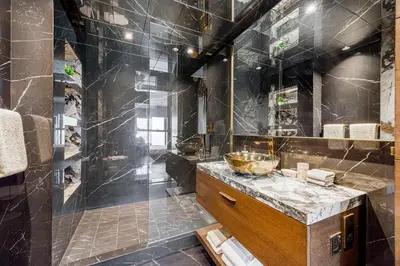 a bathroom with a sink and a shower at Daniels 3BR at Princess Tower With Full Palm Jumeirah View in Dubai