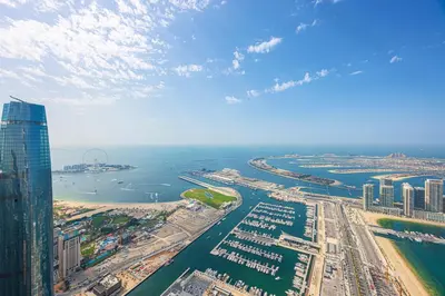 an aerial view of a city and a harbor at Daniels 3BR at Princess Tower With Full Palm Jumeirah View in Dubai