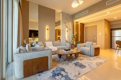 a living room with couches and a coffee table at Stunning Burj Khalifa & Fountain Views - Luxury 2BR - 5 minutes walk to Dubai Mall in Dubai