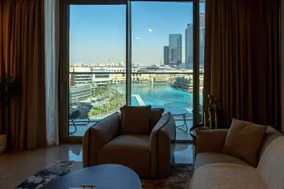 a living room with a view of a large window at Stunning Burj Khalifa & Fountain Views - Luxury 2BR - 5 minutes walk to Dubai Mall in Dubai