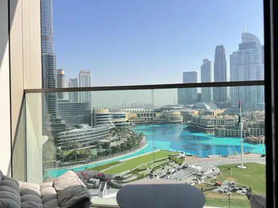a view of a city skyline from a room with a window at Stunning Burj Khalifa & Fountain Views - Luxury 2BR - 5 minutes walk to Dubai Mall in Dubai