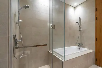 a bathroom with a shower and a sink at Modern 1Br in the Heart of Dubai by SIMPLY COMFORT in Dubai