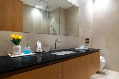 a bathroom with a sink and a mirror at Modern 1Br in the Heart of Dubai by SIMPLY COMFORT in Dubai