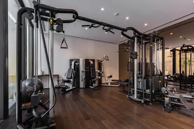 a gym with several treadmills and machines in a room at Modern 1Br in the Heart of Dubai by SIMPLY COMFORT in Dubai