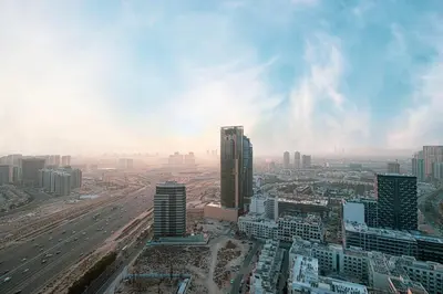 an aerial view of a city with tall buildings at Brand New Apt On Top Floor 1BR w Spa And Pool in Dubai