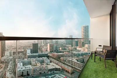 a room with a view of a city at Brand New Apt On Top Floor 1BR w Spa And Pool in Dubai