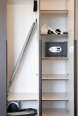 a staircase in a closet with a shelf at New 1BR APT Business Bay w Burj View in Dubai