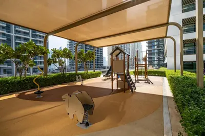 a playground with a slide in a building at Homes Beyond I Seaside 1BR Retreat with Beach Access in Dubai