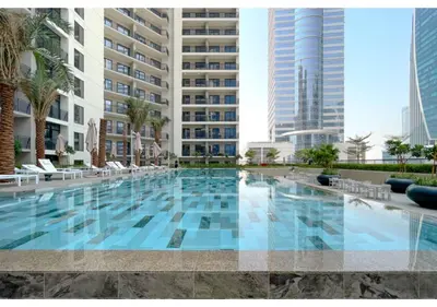 a swimming pool in the middle of a building at Exclusive Lakeview Haven - Zada Tower by Keyrock Living in Dubai