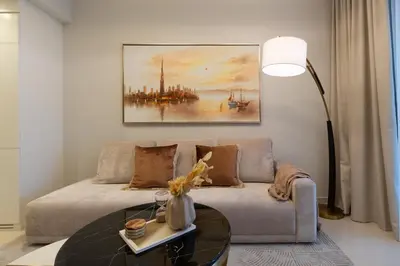 a living room with a couch and a table at Keyrock Living - Exclusive Luxury at Aykon Tower in Dubai